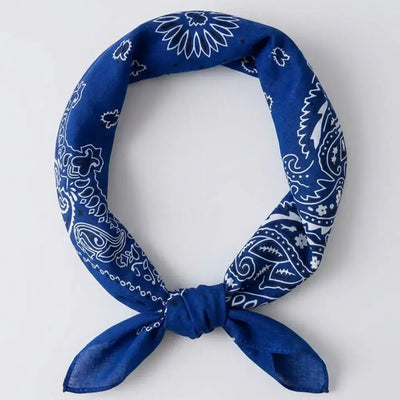 Blue crip bandana with white patterns on a light gray background