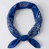 Blue crip bandana with white patterns on a light gray background
