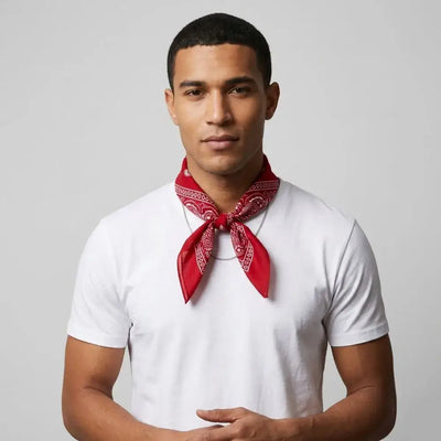 Man wearing a red bandana and white t-shirt against a gray background