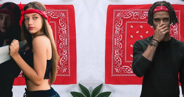 Two people wearing red bandanas with a red and white patterned backdrop.